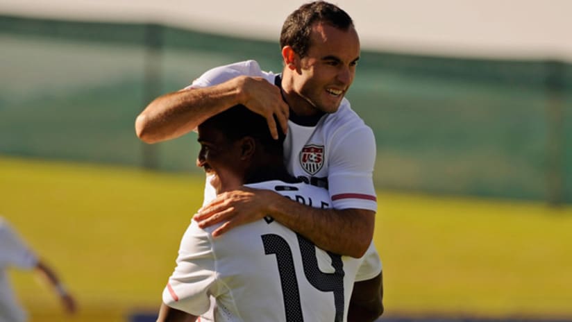 Galaxy duo Landon Donovan and Edson Buddle celebrate a goal by MLS' leading scorer