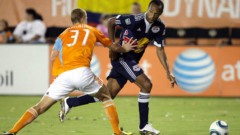 Thierry Henry glides past Houston's Andrew Hainault.